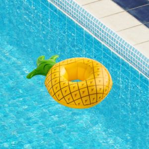pineapple drink floatie in a swimming pool