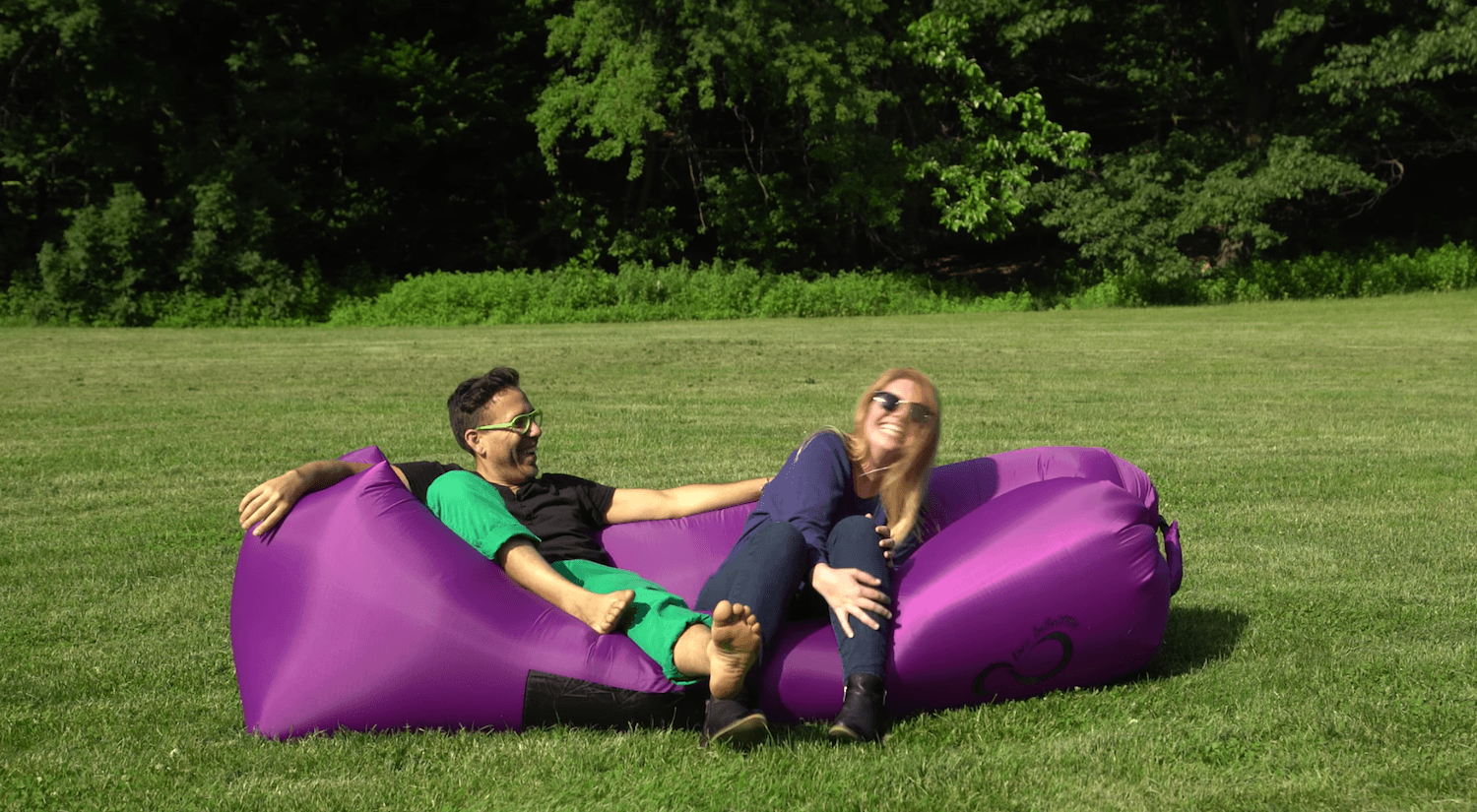 people smiling on inflatable chair